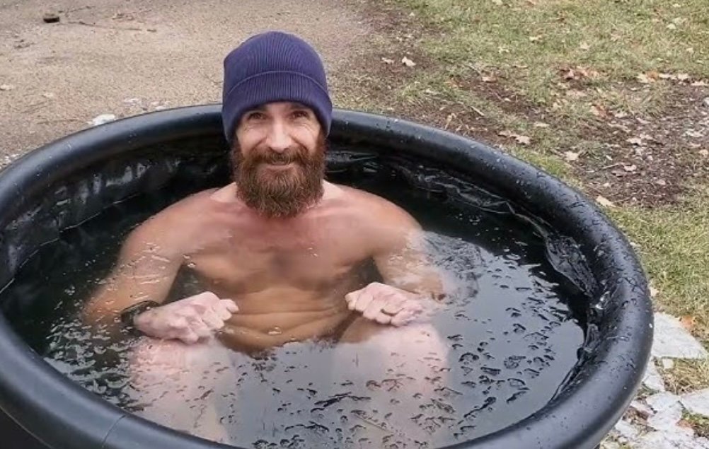 cold-plunge-recovery-technique-bjj-over-40.jpg Man doing a controlled cold plunge to support BJJ recovery and reduce inflammation when to cold plunge for recovery