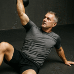 TITLE: Thoracic Mobility Drill for Grapplers Over 40 BJJ grappler performing thoracic spine mobility exercise for shoulder and upper-back movement